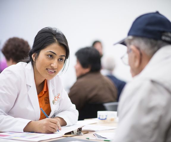 health sciences student talking with patient